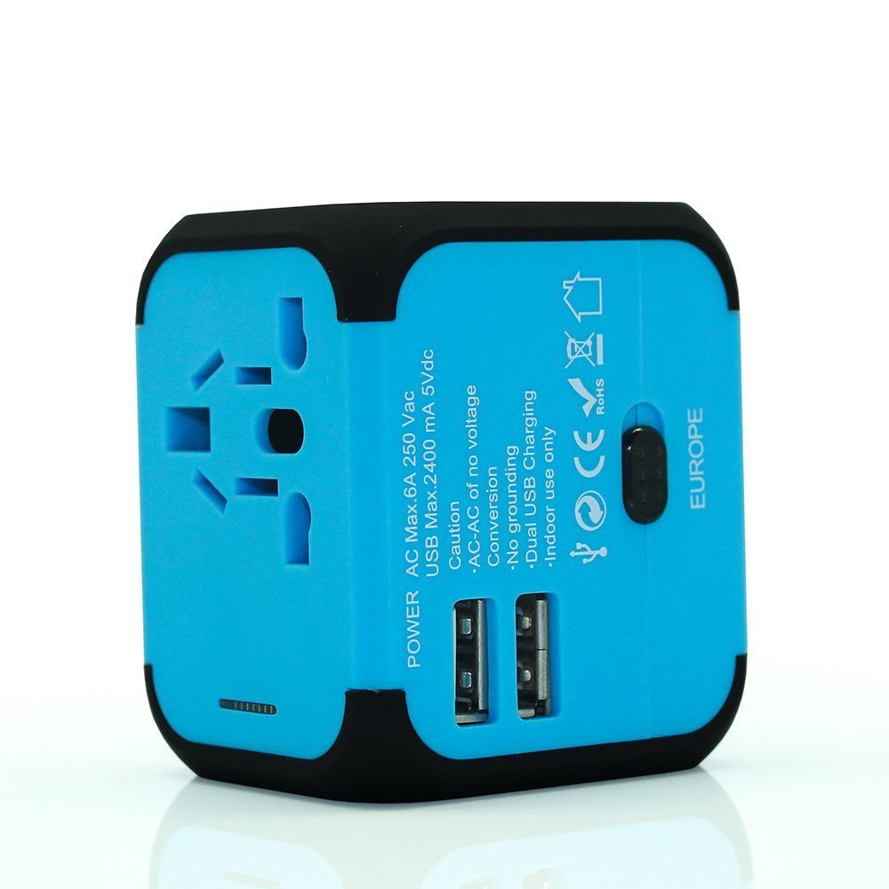 Adaptateur de voyage universel pour prises électriques. Chargeur avec 2 ports UBS (2,4 A), fusible extractible. Compatible en Europe, Etat-Unis, Grande-Bretagne, Australie, NZ Japon, et plus de 150 pays
