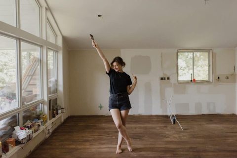 Joyful dance in a room under renovation