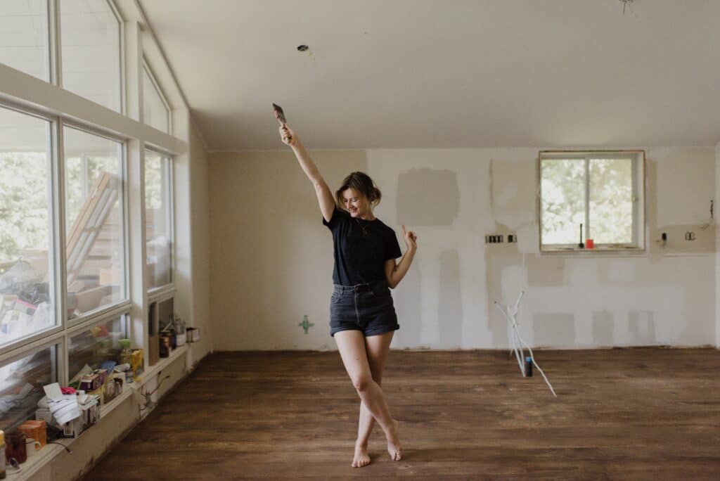 Joyful dance in a room under renovation