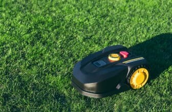 Robotic Lawn Mower cutting grass in the garden.